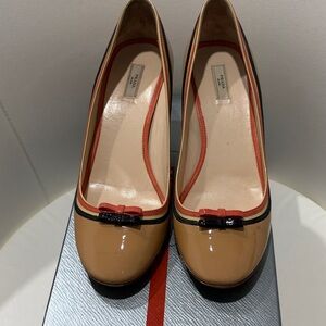 Prada Beige Patent Leather Bow Pumps with Black & Red Trim